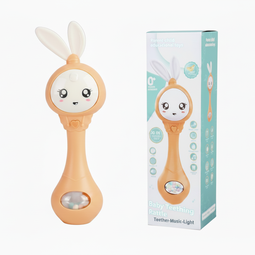 An orange baby teething rattle with white bunny ears and a cute face, shown next to its light blue and white product packaging box on a white background.