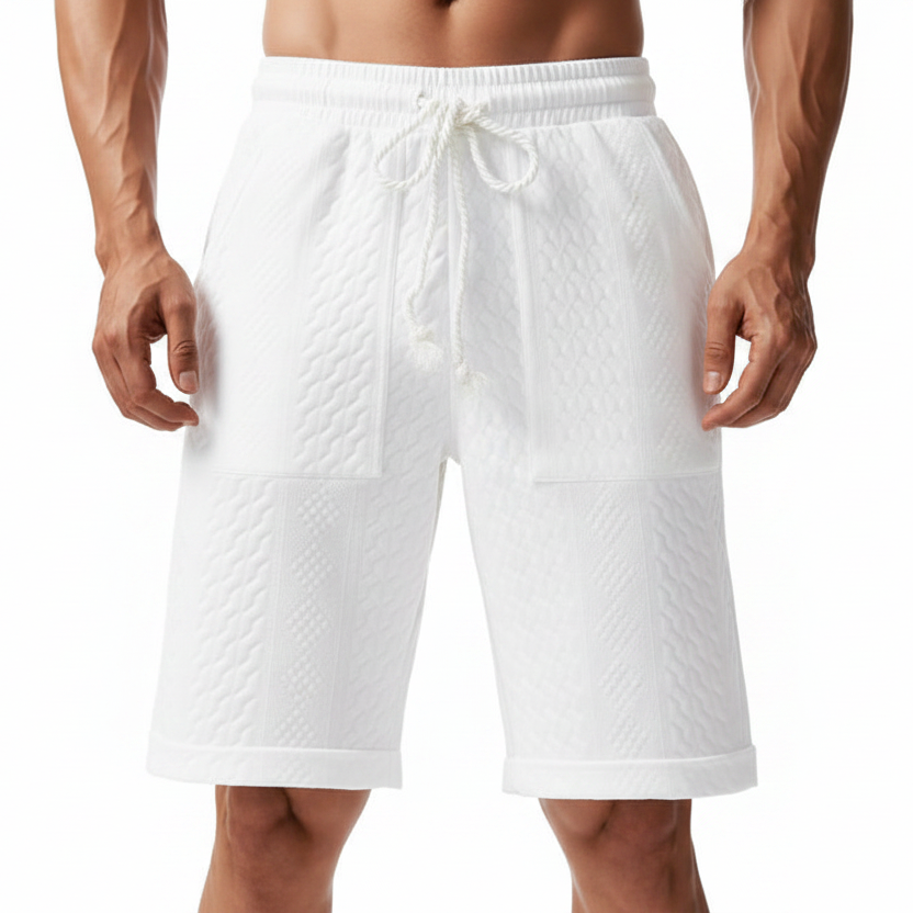 White textured drawstring shorts with a quilted pattern, shown on a model from the waist to mid-thigh against a plain white background.