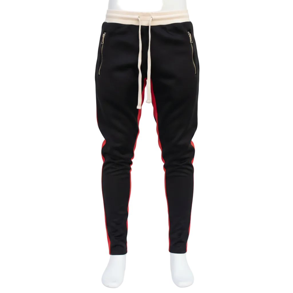 Black athletic jogger pants with red side stripes, a cream drawstring, and gold-tone zippered side pockets, shown on a white mannequin against a white studio background.