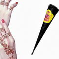 A black cone-shaped henna applicator with a yellow and pink label, shown next to a hand decorated with brown henna designs.